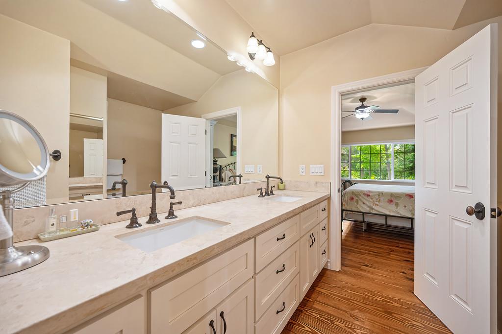 3557 Val Verde Road Loomis, CA 95650 - Photo 29 of 71 a bathroom with a double vanity sink a mirror and a bathtub