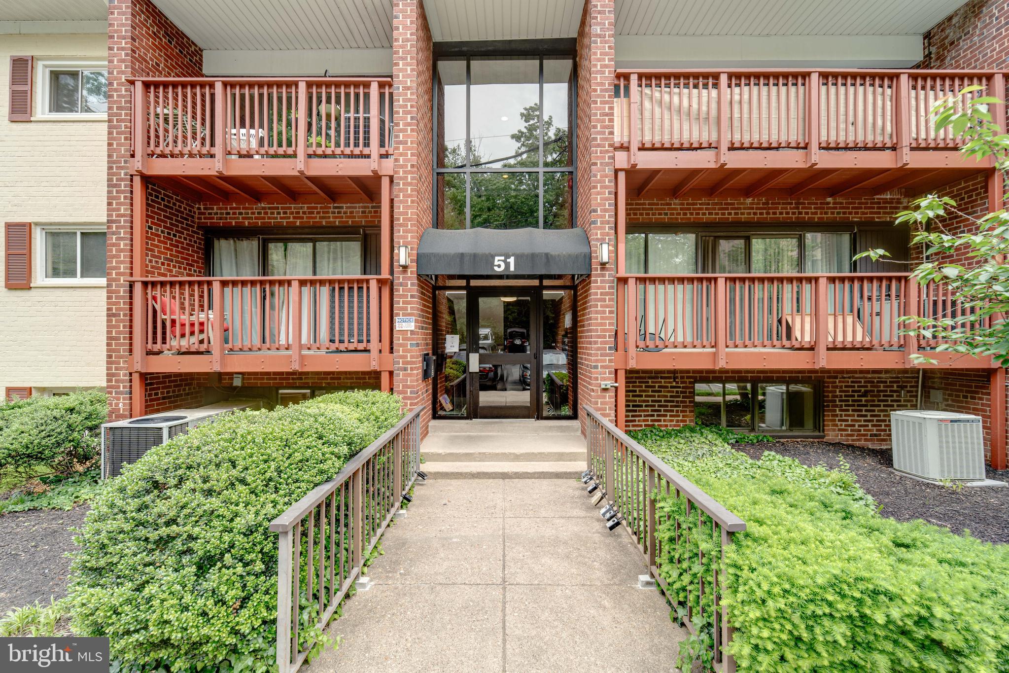 51 Skyhill Road, Unit 202 Alexandria, VA 22314 - Photo 21 of 23 a view of small house with front door