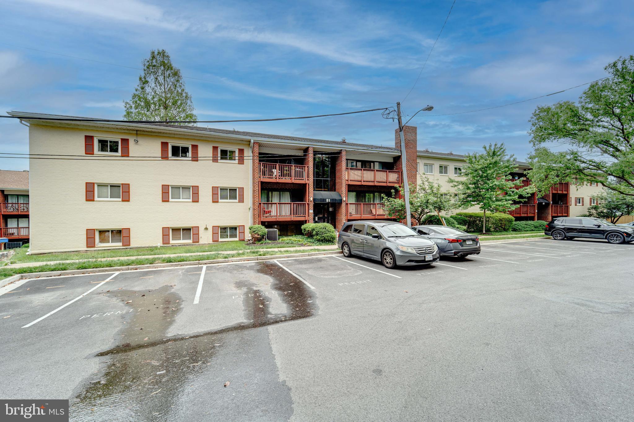 51 Skyhill Road, Unit 202 Alexandria, VA 22314 - Photo 22 of 23 a view of a car parked in front of a building