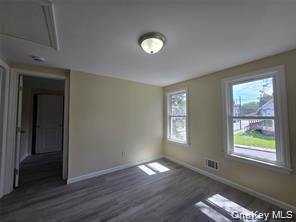 1-3 Chestnut Street Middletown, NY 10940 - Photo 15 of 19 a view of an empty room with wooden floor and a window