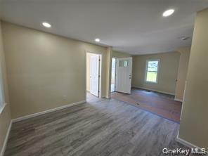 1-3 Chestnut Street Middletown, NY 10940 - Photo 2 of 19 a view of wooden floor and windows in a room