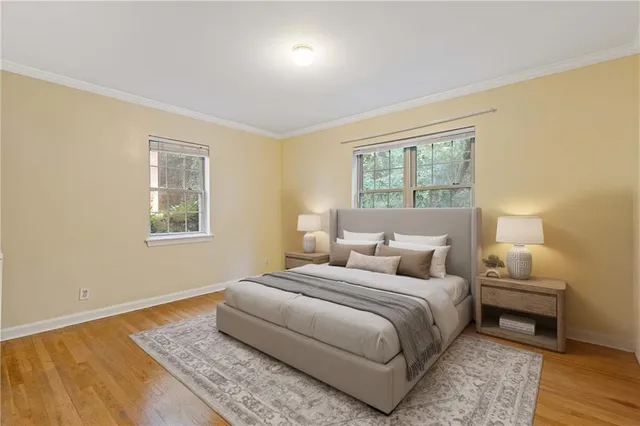 a bedroom with a bed and a night stand