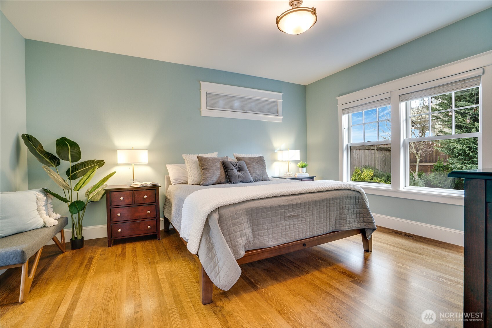 3501 North Stevens Street Tacoma, WA 98407 - Photo 13 of 39 a bedroom with a bed and wooden floor
