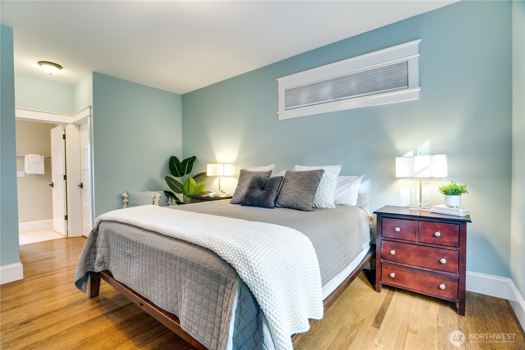 3501 North Stevens Street Tacoma, WA 98407 - Photo 14 of 39 a bedroom with a bed and a lamp on dresser