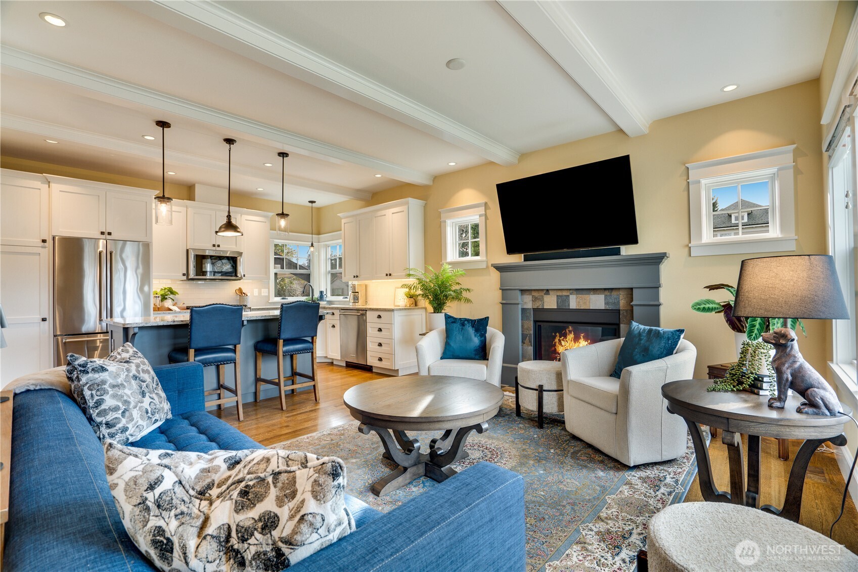 3501 North Stevens Street Tacoma, WA 98407 - Photo 6 of 39 a living room with furniture a flat screen tv and a fireplace