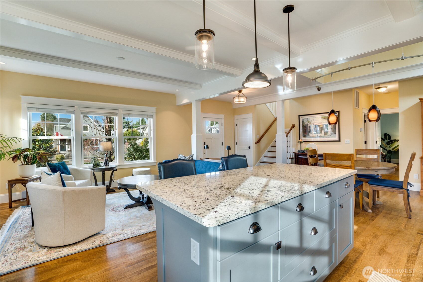 3501 North Stevens Street Tacoma, WA 98407 - Photo 10 of 39 a view of a dining room and livingroom with furniture wooden floor a chandelier