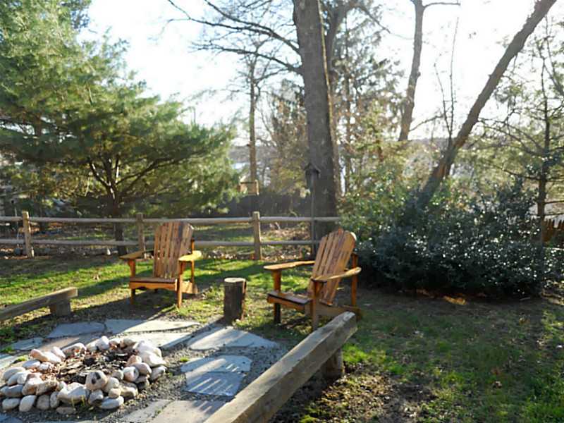 7 Seneca Street Coventry, RI 02816 - Photo 24 of 25 Yard/Garden. Enjoy views of Lake Tiogue while relaxing in the back yard.