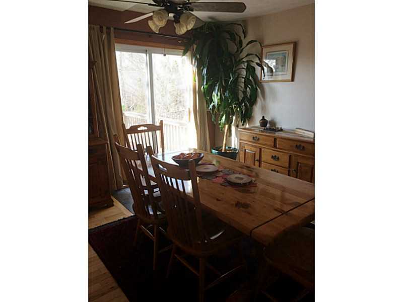7 Seneca Street Coventry, RI 02816 - Photo 7 of 25 Dining Room. Newer sliders lead out to the recently installed composite deck.