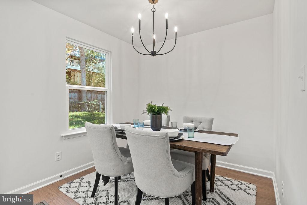 6 Willow Branch Lane Fredericksburg, VA 22405 - Photo 13 of 56 a view of a dining room with furniture window and wooden floor