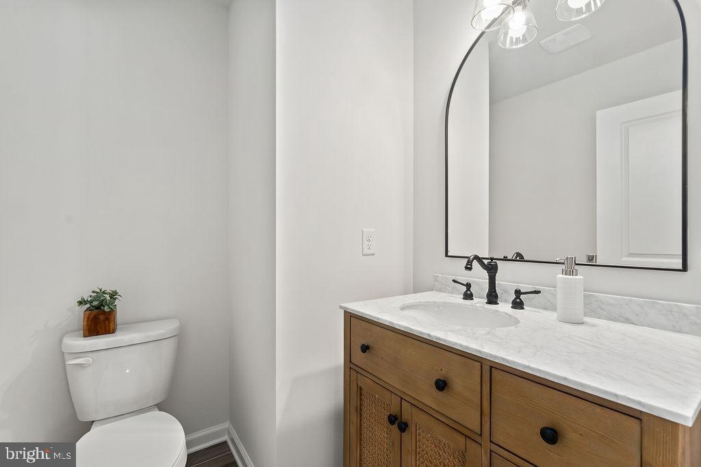 6 Willow Branch Lane Fredericksburg, VA 22405 - Photo 14 of 56 a bathroom with a toilet sink and mirror