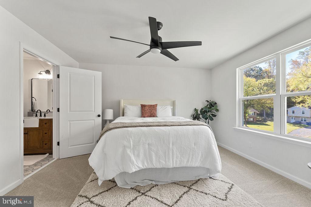 6 Willow Branch Lane Fredericksburg, VA 22405 - Photo 16 of 56 a spacious bedroom with a bed and a window