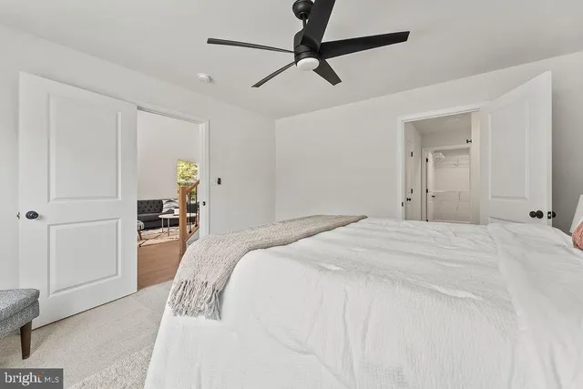 a bathroom with a granite countertop sink a mirror and a shower