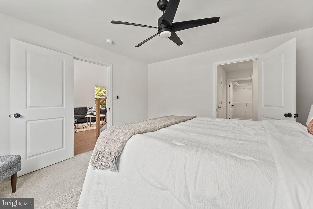 6 Willow Branch Lane Fredericksburg, VA 22405 - Photo 18 of 56 a bedroom with a bed and a chandelier