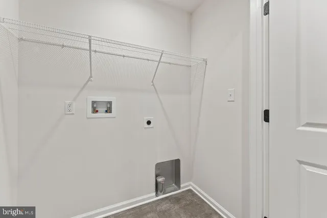 a bathroom with a granite countertop sink mirror vanity and toilet