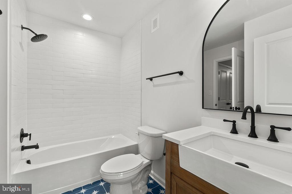 6 Willow Branch Lane Fredericksburg, VA 22405 - Photo 38 of 56 a bathroom with a sink a toilet and a bathtub