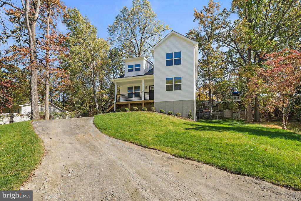6 Willow Branch Lane Fredericksburg, VA 22405 - Photo 49 of 56 a front view of a house with a yard and trees