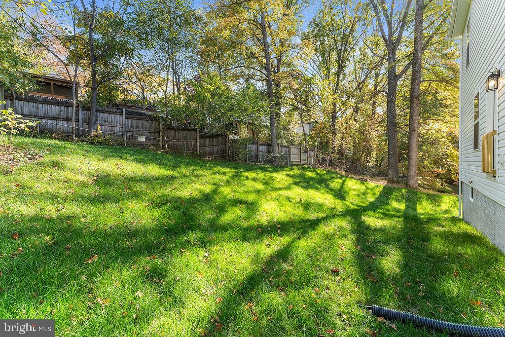 6 Willow Branch Lane Fredericksburg, VA 22405 - Photo 53 of 56 a backyard of a house with lots of green space and fountain