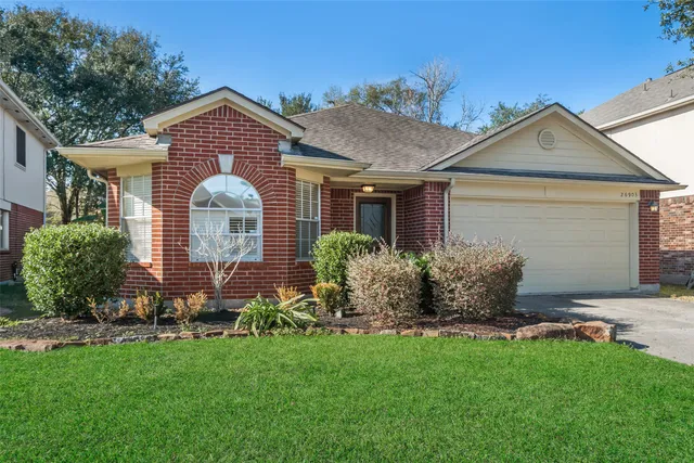 a front view of house with yard and outdoor seating