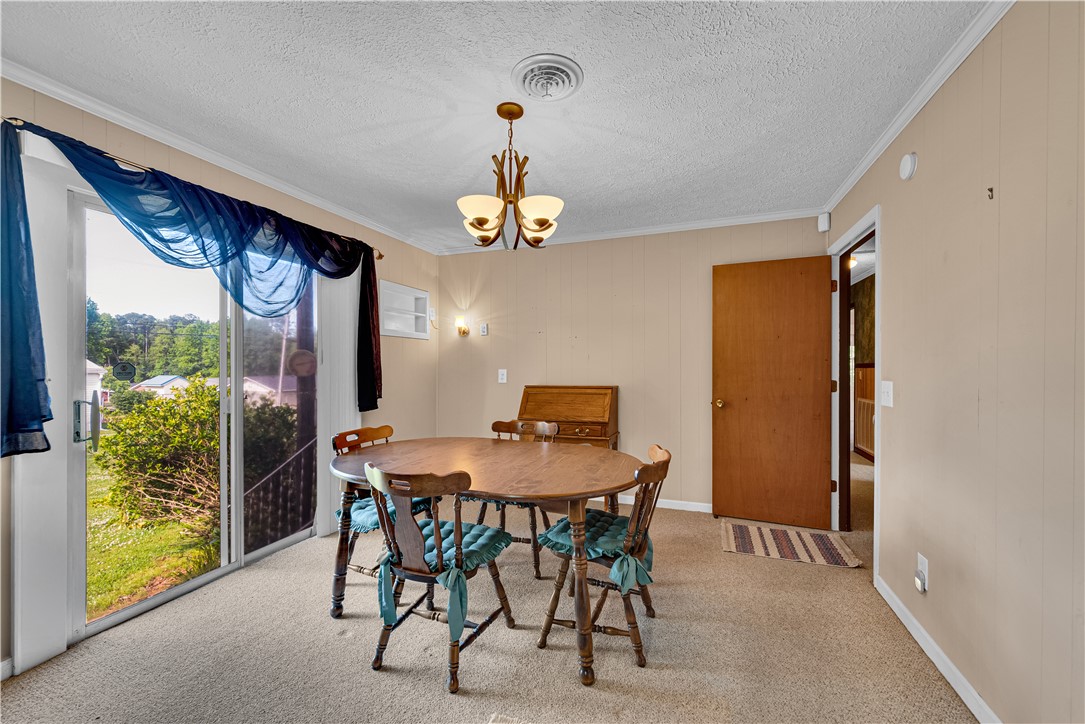 307 Calhoun Road Belton, SC 29627 - Photo 27 of 30 Dining area with sliding doors opens to outdoor living space, ideal for entertaining.