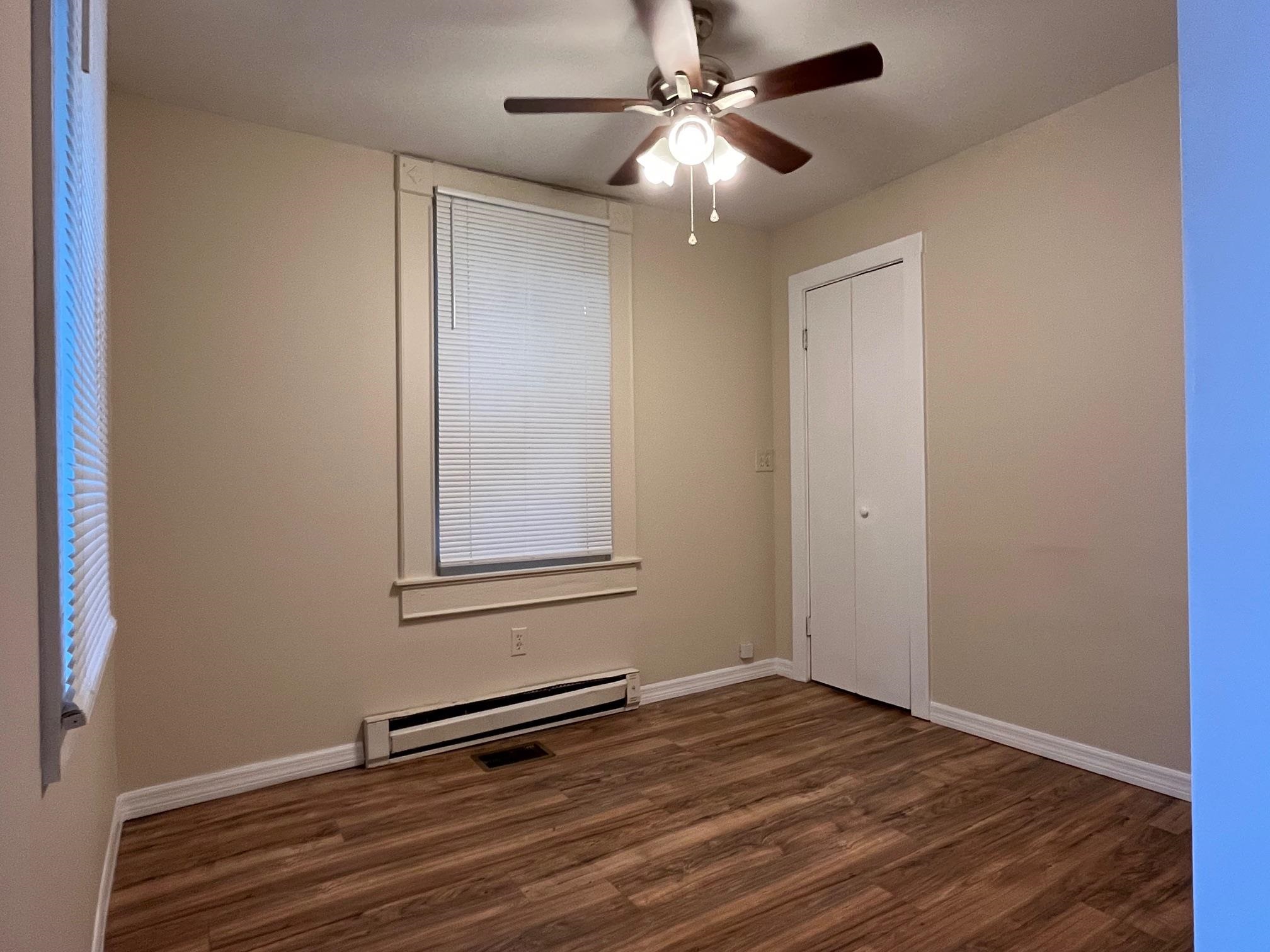 25 Desoto Place, Unit 2 St. Augustine, FL 32084 - Photo 11 of 14 a view of empty room with wooden floor and fan