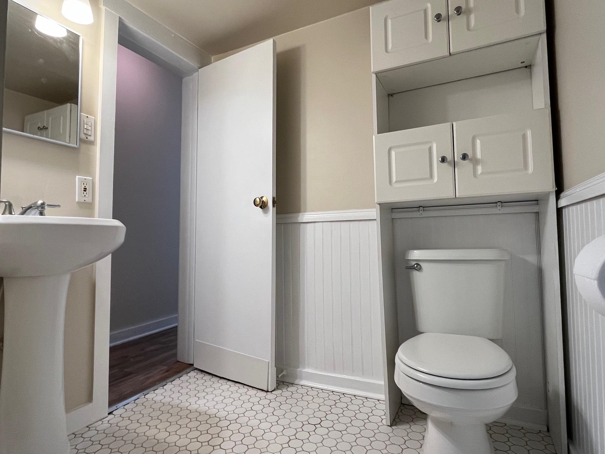 25 Desoto Place, Unit 2 St. Augustine, FL 32084 - Photo 8 of 14 a bathroom with a sink toilet and a mirror