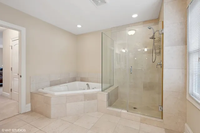 a bathroom with a bathtub and shower