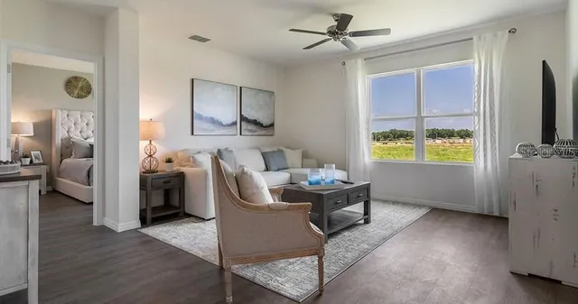 a living room with furniture and a window
