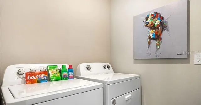 a utility room with dryer and washer