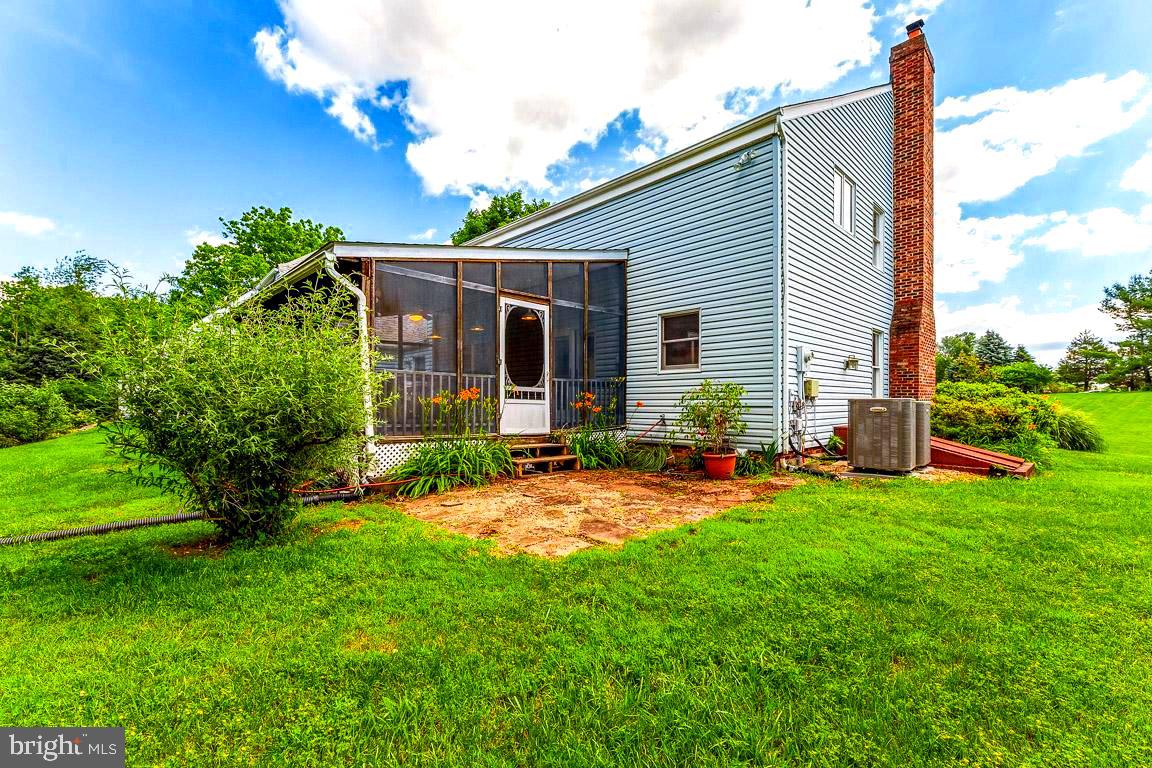 4874 Executive Drive Gainesville, VA 20155 - Photo 61 of 74 Screened in porch, patio and gardens