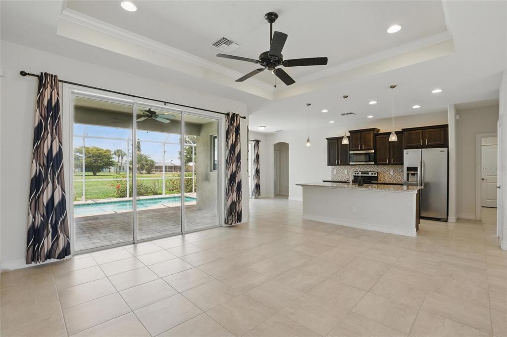 7505 Carissa Punta Gorda, FL 33955 - Photo 13 of 57 a view of open kitchen with a sink and a large window