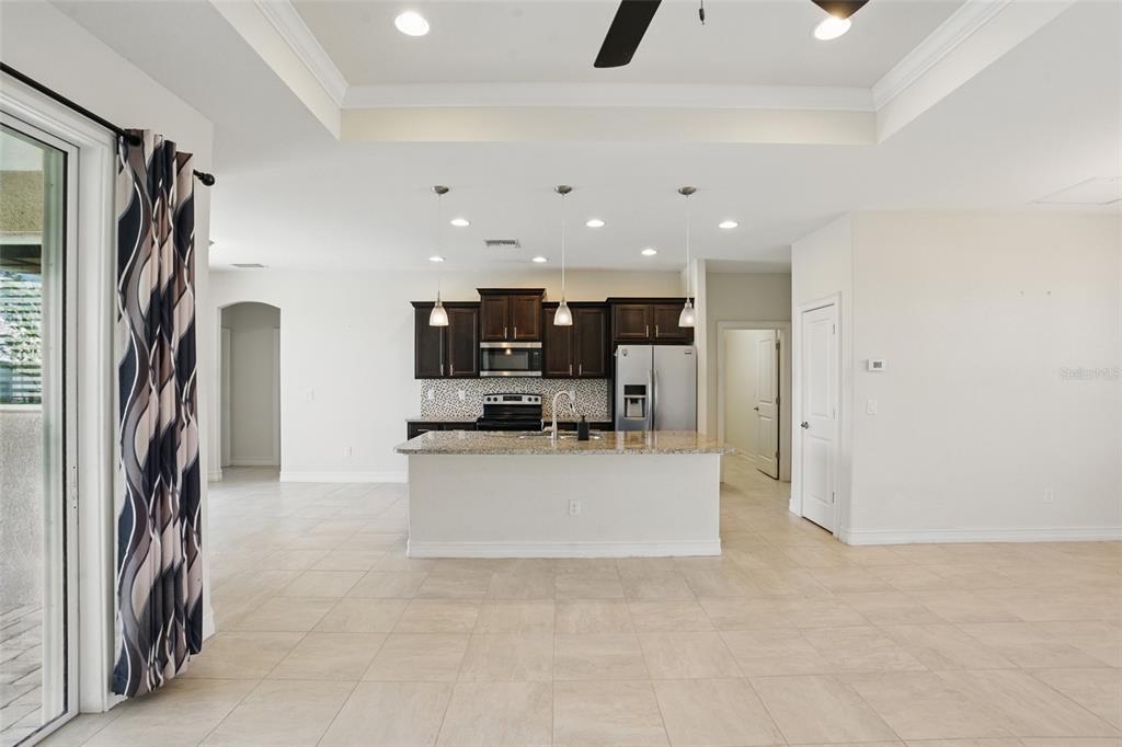 7505 Carissa Punta Gorda, FL 33955 - Photo 14 of 57 a view of living room with stainless steel appliances furniture a rug and a window