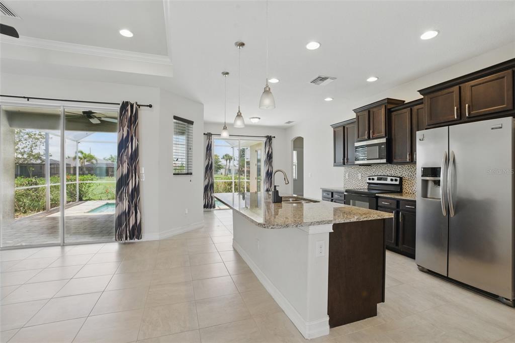 7505 Carissa Punta Gorda, FL 33955 - Photo 19 of 57 a large kitchen with stainless steel appliances lots of counter space and breakfast area