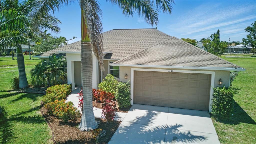 7505 Carissa Punta Gorda, FL 33955 - Photo 2 of 57 front view of a house with a yard