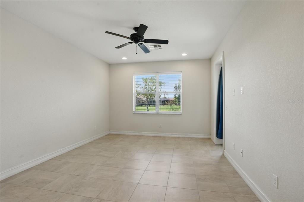 7505 Carissa Punta Gorda, FL 33955 - Photo 26 of 57 an empty room with windows and fan