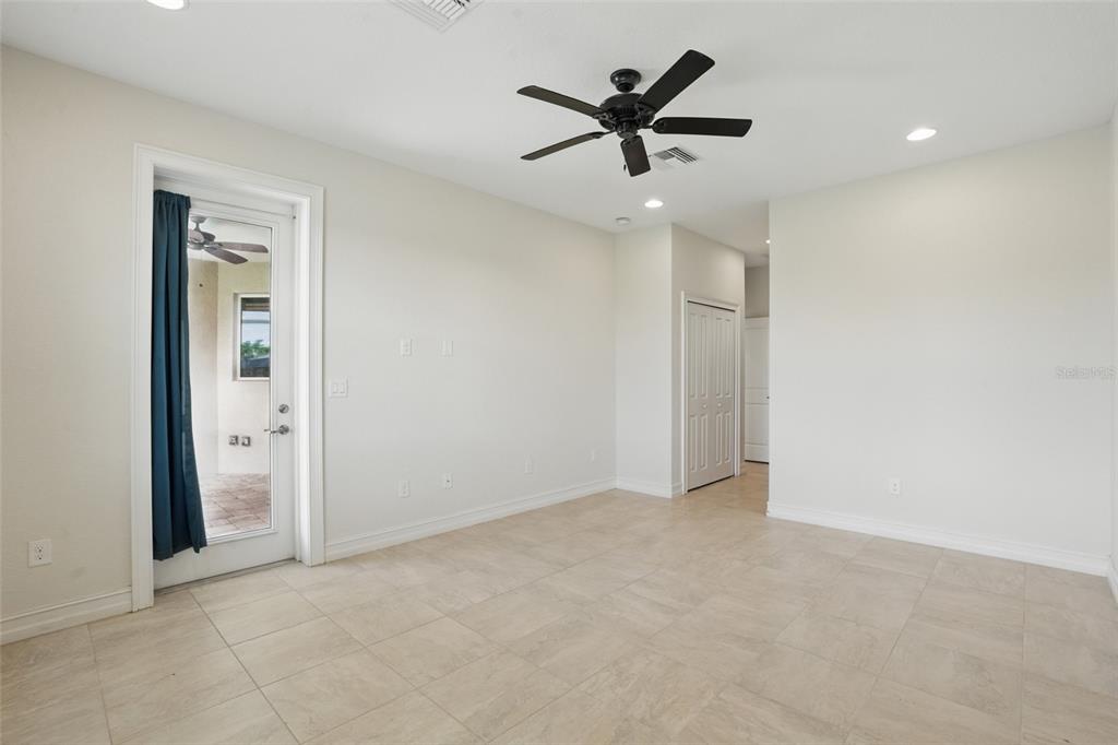 7505 Carissa Punta Gorda, FL 33955 - Photo 28 of 57 an empty room with a ceiling fan and window