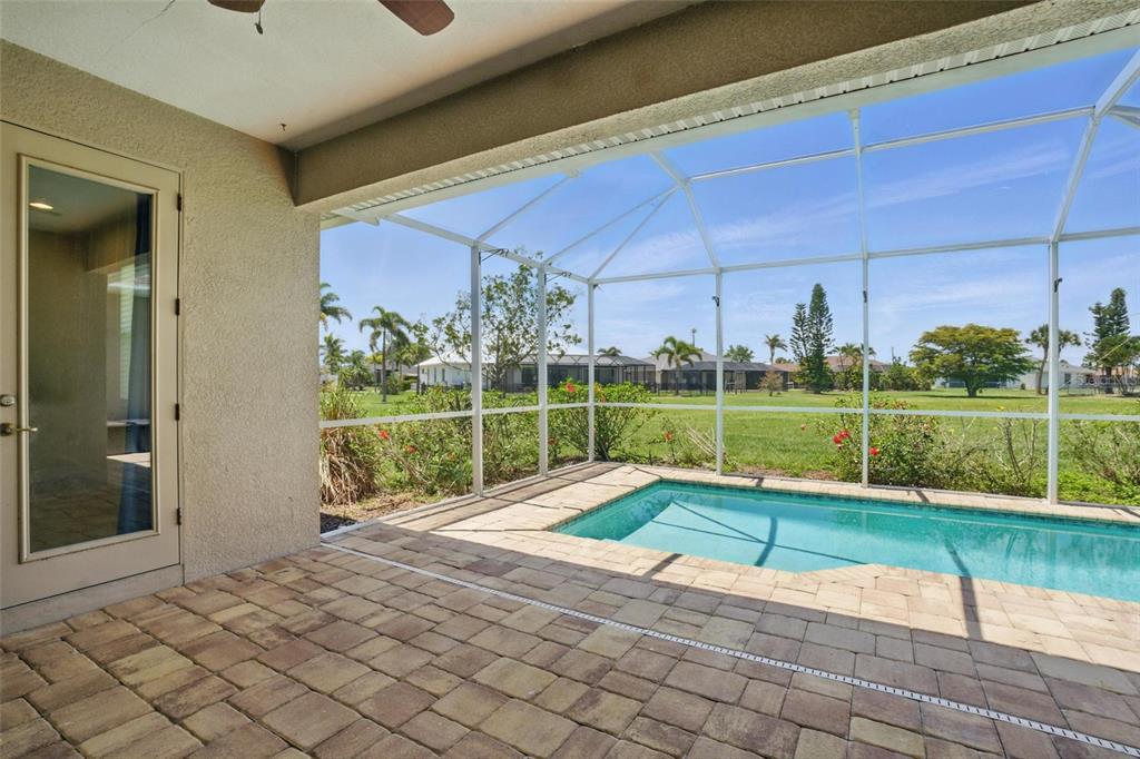 7505 Carissa Punta Gorda, FL 33955 - Photo 42 of 57 a view of a house with a big yard and potted plants
