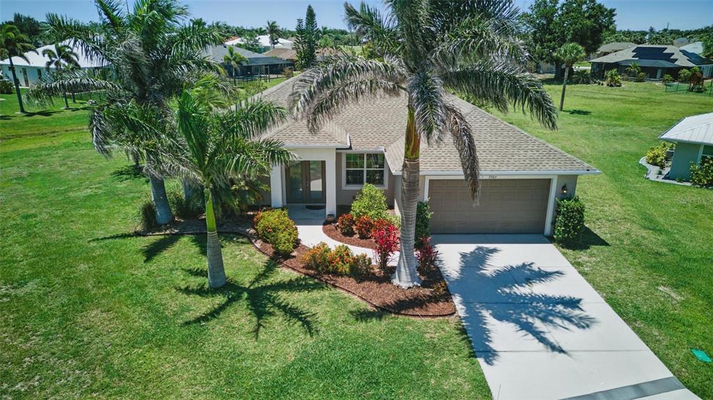 7505 Carissa Punta Gorda, FL 33955 - Photo 5 of 57 a front view of house with a garden and patio