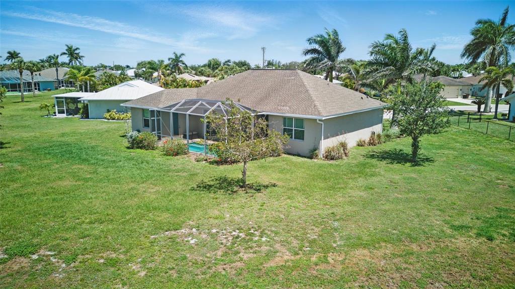 7505 Carissa Punta Gorda, FL 33955 - Photo 54 of 57 a front view of a house with garden