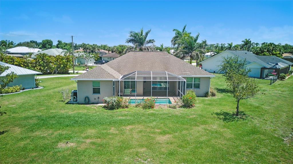 7505 Carissa Punta Gorda, FL 33955 - Photo 55 of 57 a view of a house with a yard and sitting area