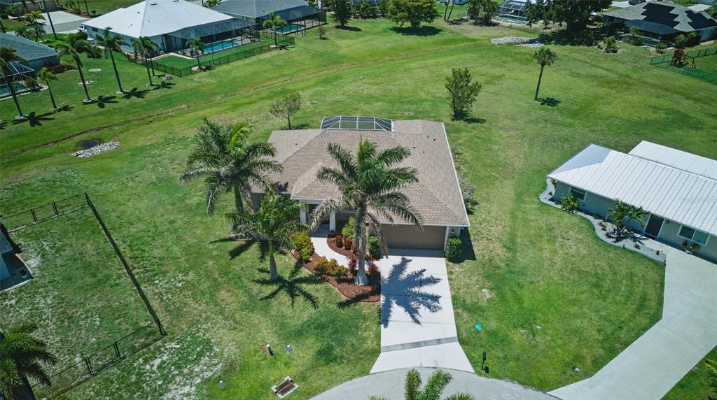 7505 Carissa Punta Gorda, FL 33955 - Photo 7 of 57 a view of a garden with a fountain