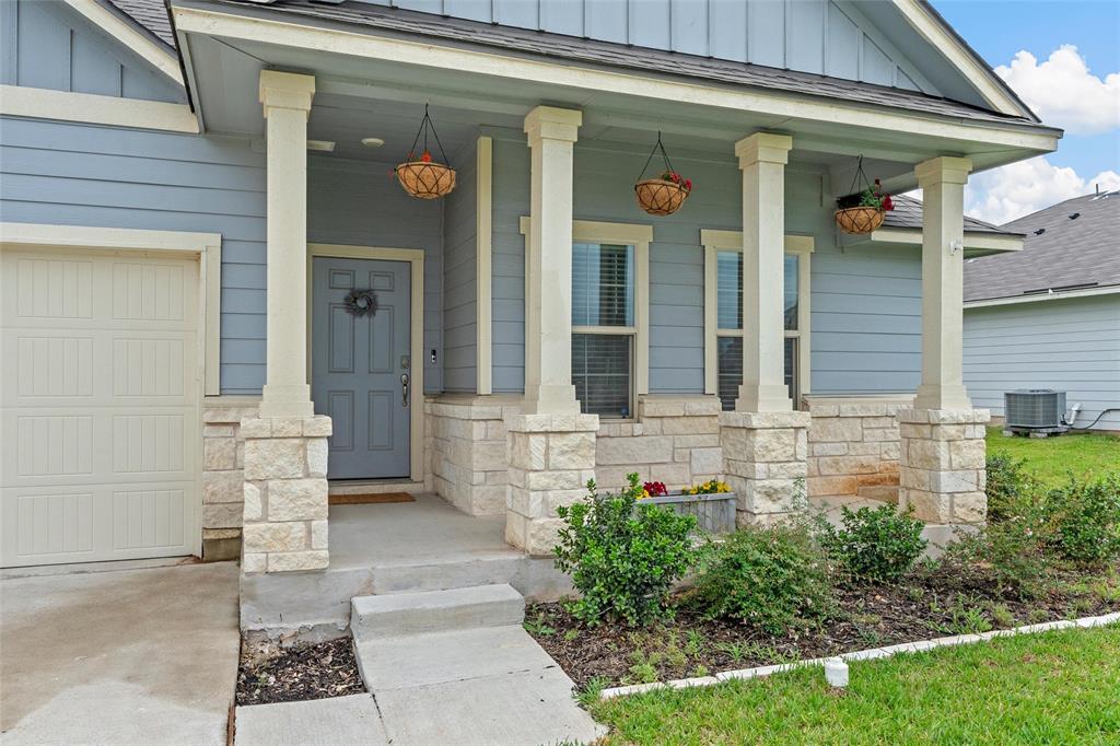 10712 Peperak Court Waco, TX 76708 - Photo 3 of 25 a front view of a house with a garden