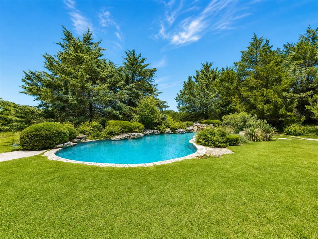 151 Trinity Bluffs Road Aledo, TX 76008 - Photo 32 of 40 a view of a swimming pool with an outdoor space