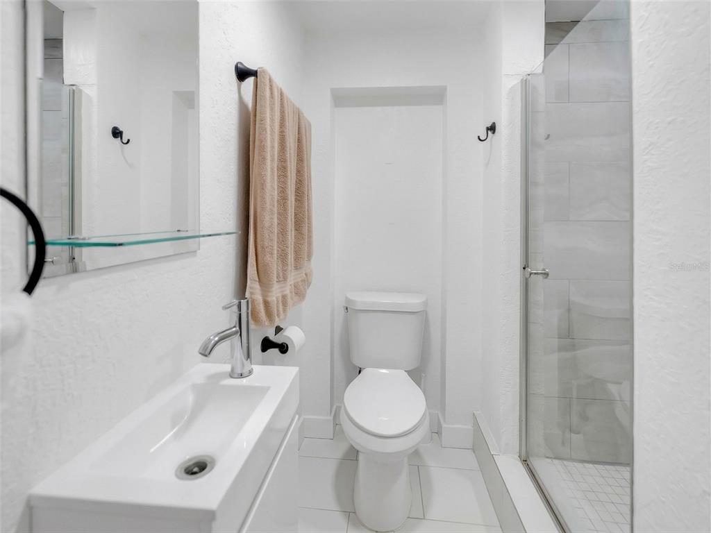 2600 Euston Road Winter Park, FL 32789 - Photo 15 of 36 a bathroom with a sink a toilet and shower