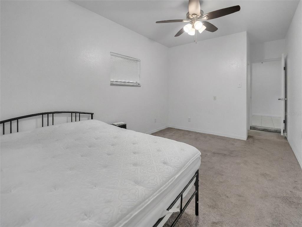 2600 Euston Road Winter Park, FL 32789 - Photo 20 of 36 a view of a hallway with a chandelier fan