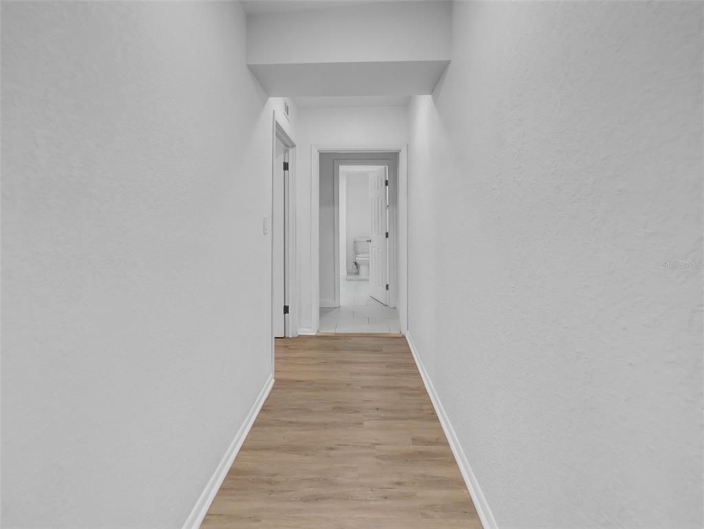2600 Euston Road Winter Park, FL 32789 - Photo 21 of 36 a view of a hallway with wooden floor