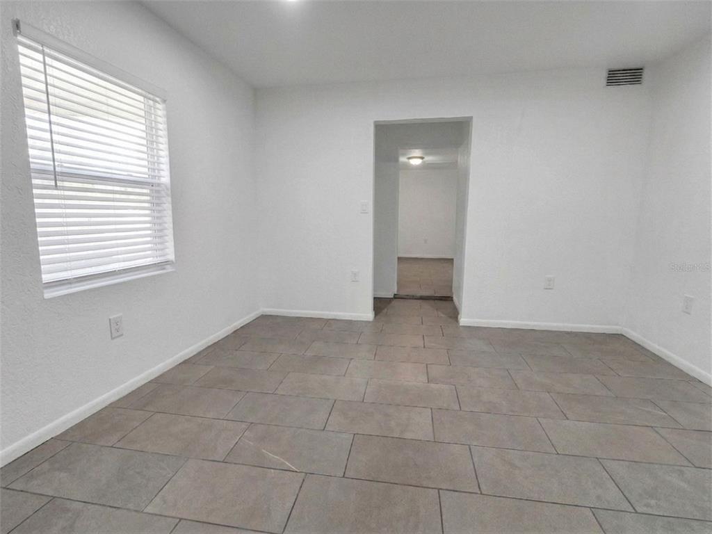 2600 Euston Road Winter Park, FL 32789 - Photo 7 of 36 a view of an empty room and a window