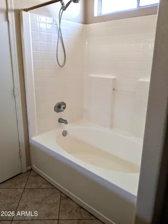 a bathroom with a bath tub and a shower
