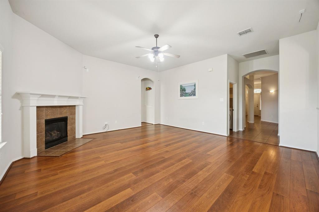 3501 Gravel Circle North Grapevine, TX 76092 - Photo 12 of 36 a view of empty room with wooden floor and fireplace
