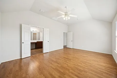 a view of an empty room with a bathroom