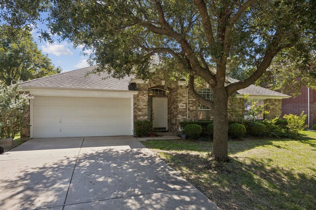 3501 Gravel Circle North Grapevine, TX 76092 - Photo 2 of 36 a front view of a house with a yard and garage